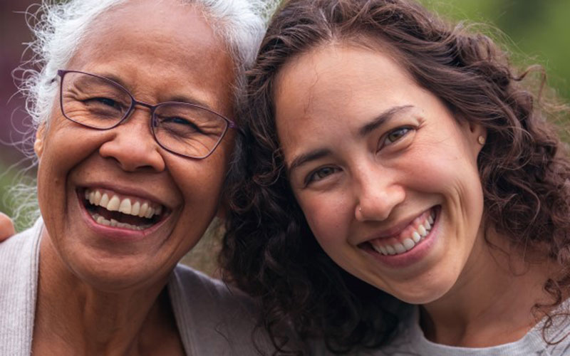 Two adults smiling